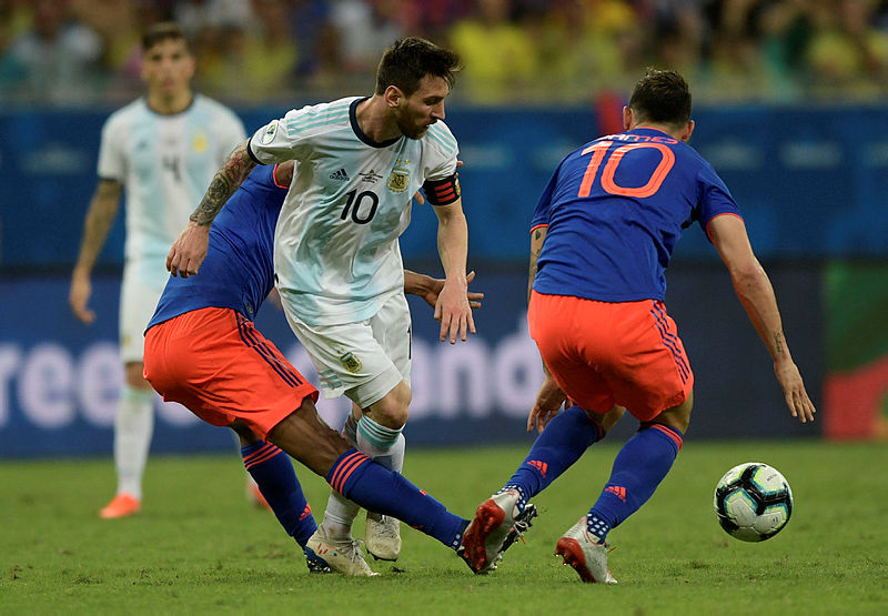 Argentina’s Lionel Messi (C) is fouled by Colombia’s Juan Guillermo Cuadrado (L) as James Rodriguez looks on during their Copa America football tournament group match at the Fonte Nova Arena in Salvador, Brazil, on June 15, 2019. — AFP