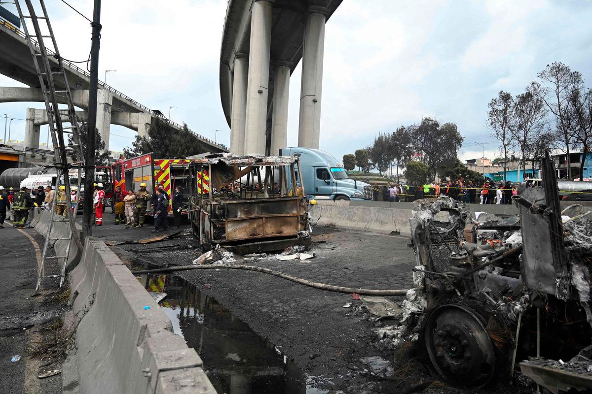 Mexican firefighters guard the area where a gas truck exploded in Mexico City on September 10, 2025. Nearly 60 people were wounded, 19 gravely, when a gas truck exploded in Mexico City on September 10, 2025, causing widespread damage, municipal officials said. (Photo by Valentina ALPIDE / AFP)
