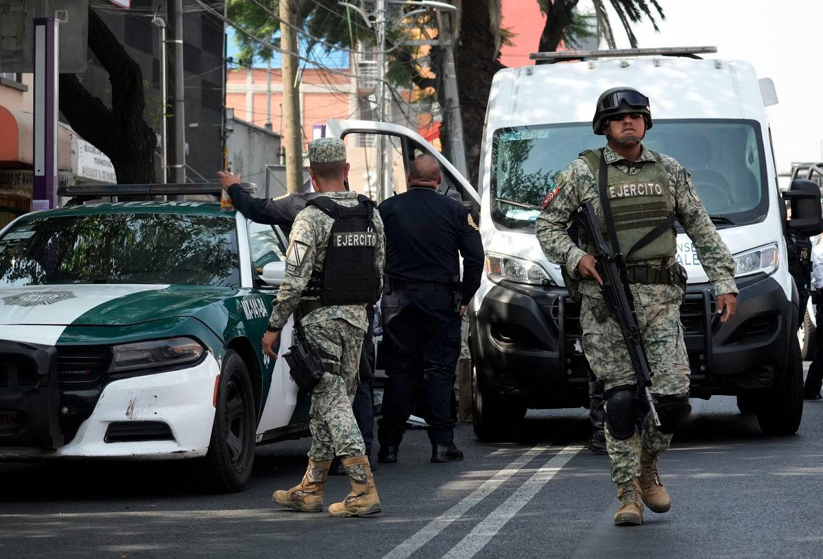 Army soldiers patrol near the crime scene of the killing of Jose Munoz and Ximena Guzman in Mexico city on May 20, 2025. Gunmen on a motorcycle shot dead Munoz and Guzman, an aide to Mexico City Mayor Clara Brugada, at a busy avenue in the capital on May 20, 2025, authorities said. AFPpix