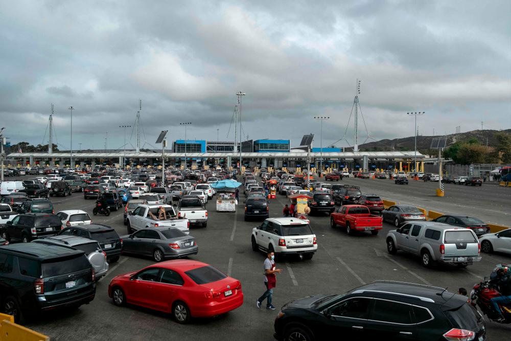 This file photo taken on August 20, 2021 shows a view of the San Ysidro crossing port on the Mexican side of the US-Mexico border in Tijuana, Baja Caifornia state. AFPpix