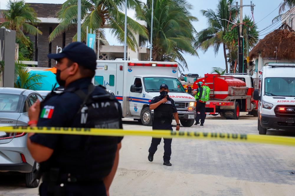 Police officers guard a scene where an explosion occurred at the Kool Beach restaurant, presumably caused by gas accumulation, which left four tourists injured, according to local media, in Playa del Carmen, Mexico March 14, 2022. REUTERSpix