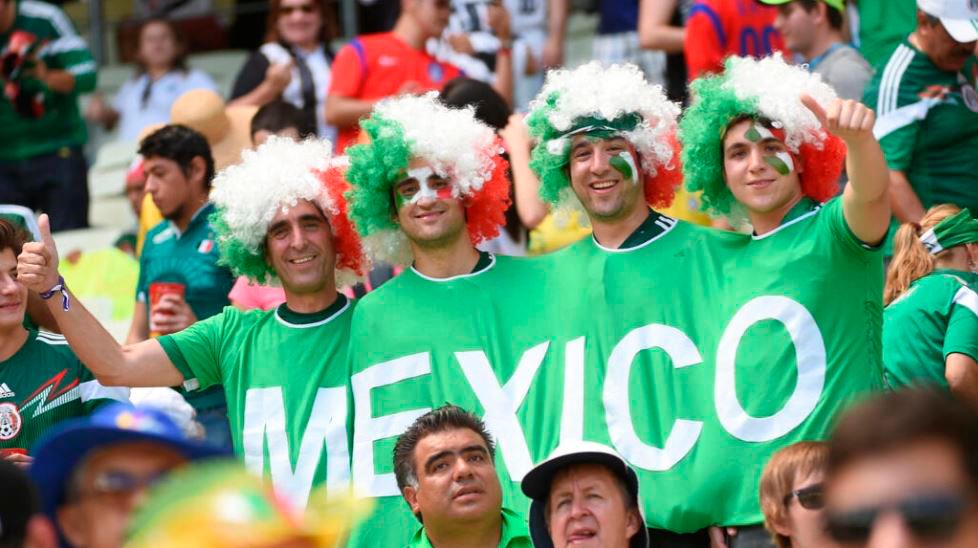 Mexican supporters cheer for their team during the 2014 World Cup in Brazil. AFPPIX