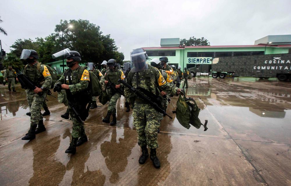 Members of the Mexican Army prepare to move towards the municipalities of Valladolid and Tizimin, in Merida, Yucatan state, in preparation for the arrival of Hurrican Delta on October 6, 2020. — AFP