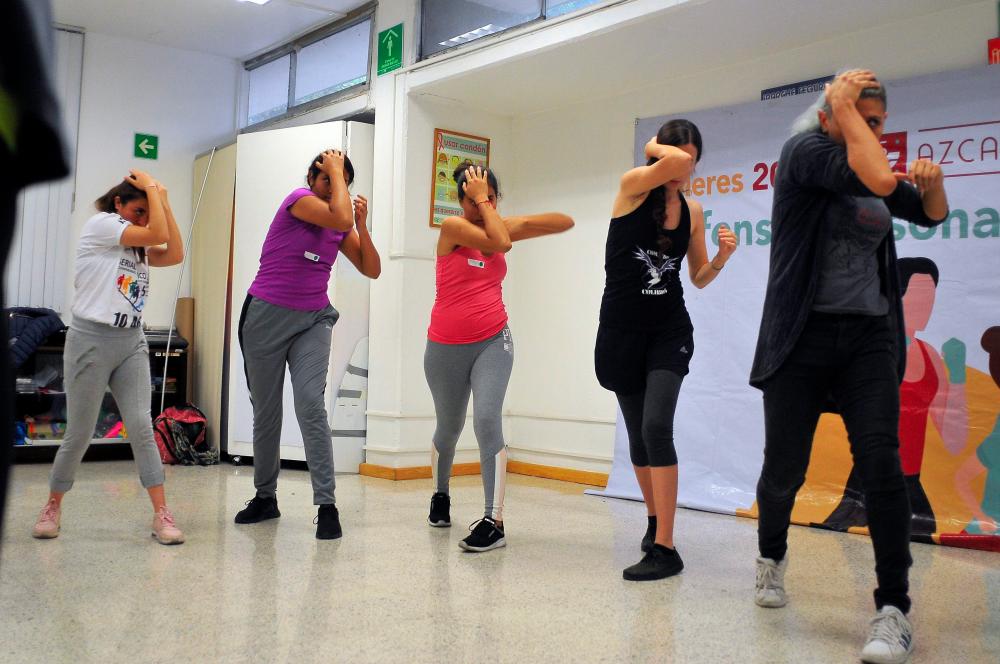 File photo taken on Oct 16 shows a group of young women attend a self-defense class in Mexico City. — AFP