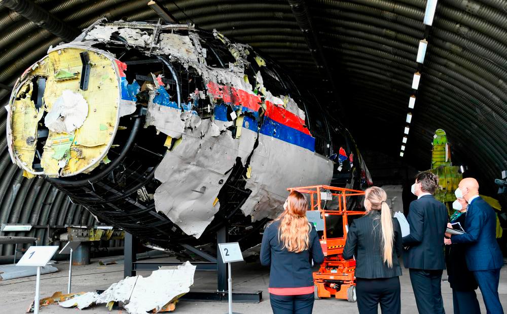 FILEPIX: Presiding Judge Hendrik Steenhuis inspects the reconstruction of the MH17 wreckage, as part of the murder trial ahead of the beginning of a critical stage, in Reijen, Netherlands, May 26, 2021. REUTERSPIX