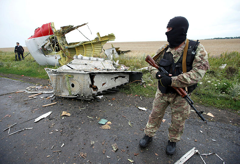 Filepix of a pro-Russian separatist standing at the crash site of Malaysia Airlines flight MH17, near the village of Hrabove (Grabovo) in Donetsk region, Ukraine, July 18, 2014. — AFP