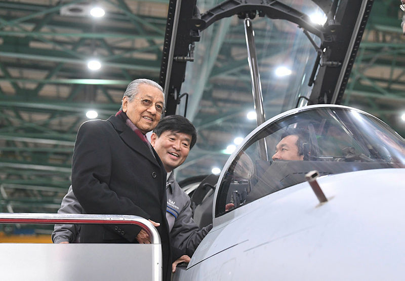 Prime Minister Tun Dr Mahathir Mohamad, with representatives from Korea Aerospace Industries (KAI), as he checks out the FA-50 Fighting Eagle light combat aircraft (LCA), on Nov 25, 2019. — Bernama