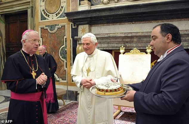 Ex-bishop Michael Bransfield (L), seen here in 2010 at a birthday celebration for then pope Benedict XVI, has been sued over allegations he knowingly employed pedophiles in schools — AFP