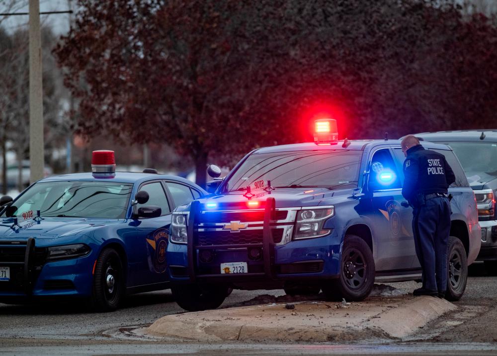 Emergency personnel respond to the scene of a deadly shooting where at least three were killed and eight were wounded at a high school in Oxford, Michigan, about 35 miles (55 km) north of Detroit, U.S., November 30, 2021. REUTERSpix