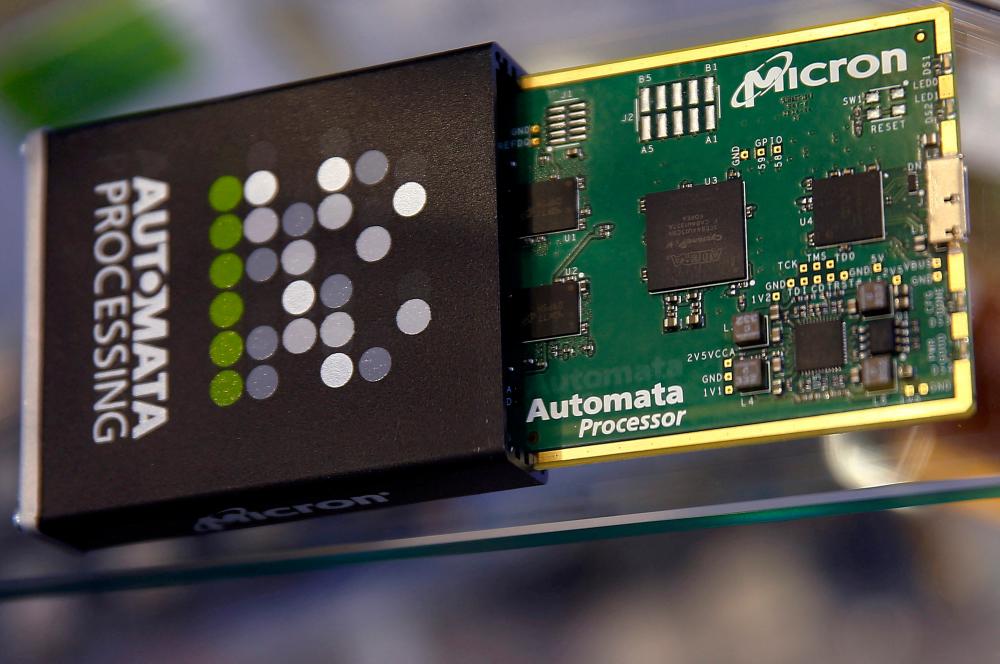 Micron memory chip parts are pictured at an industrial fair in Frankfurt, Germany, in July 2015. Micron said late last month that it will reduce production. – Reuterspix