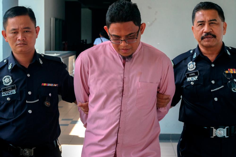 Imam Muhammad Zaki Kamal, 30, who pleaded not guilty in the Malacca magistrates’ court today on charges of injuring his wife last year. - Bernama