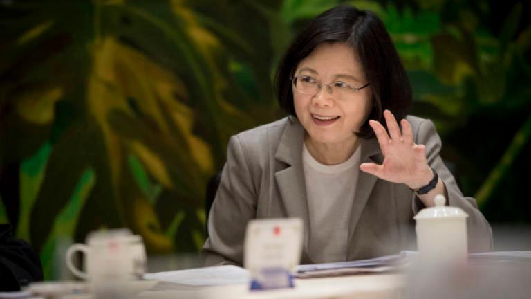Taiwan president oversees drills on warship, lauds determination for defence
