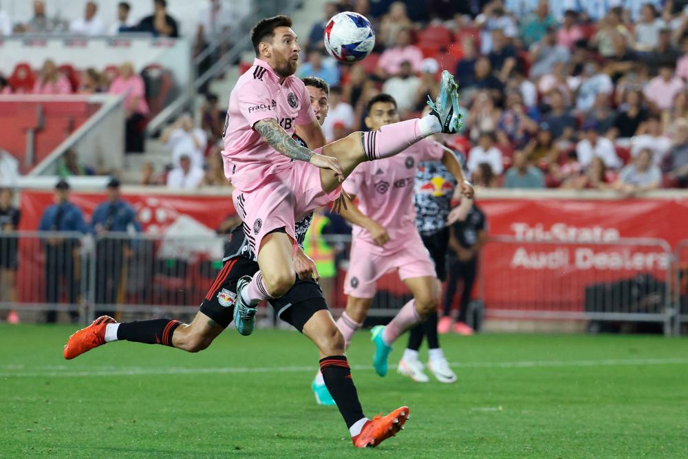 HARRISON, NEW JERSEY - AUGUST 26: Lionel Messi #10 of Inter Miami CF jumps for the ball in the second half during a match between Inter Miami CF and New York Red Bulls at Red Bull Arena on August 26, 2023 in Harrison, New Jersey. AFPPIX