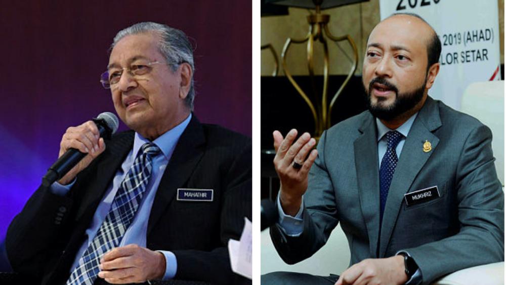 Prime Minister Tun Dr Mahathir Mohamad (left) and his son Datuk Seri Mukhriz Mahathir.