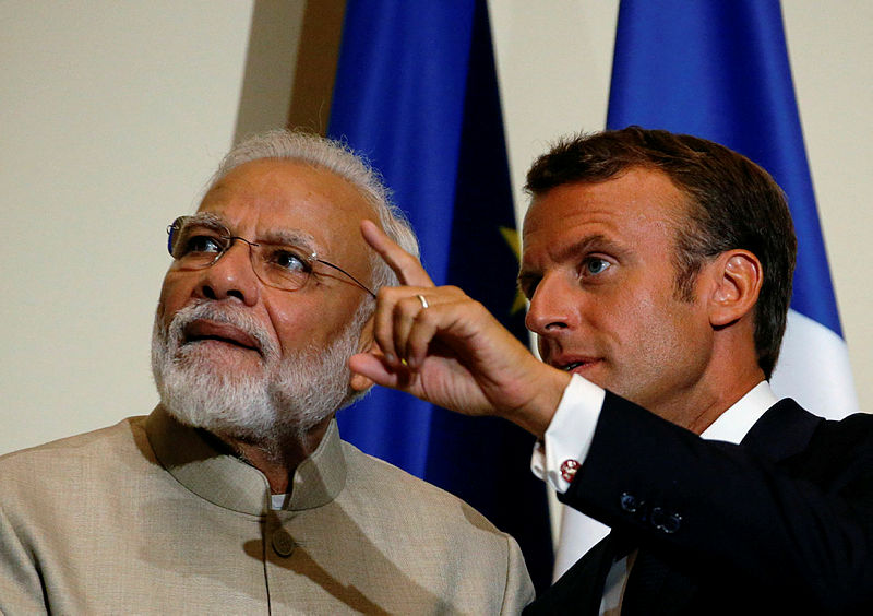 French President Emmanuel Macron gestures as Indian Prime Minister Narendra Modi looks on (L) after their joint statement following a meeting at the Chateau of Chantilly on Aug 22, 2019, near Paris. — AFP