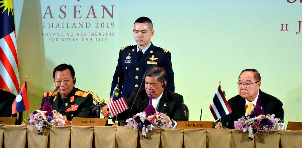Defence Minister Mohamad Sabu (C), with Thailand’s Deputy Prime Minister Gen Prawit Wongsuwan (R), and Laos’ Defence Minister Jen Chansamone Chanyalathat the 13th Asean Defence Ministers’ Meeting (ADMM), in Bangkok, on July 12, 2019. — Bernama