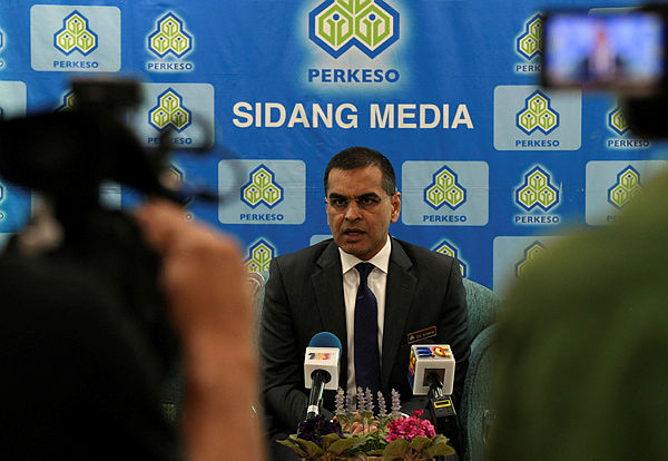 Socso CEO Dr Mohammed Azman Aziz speaks at a press conference today, warning drivers of taxis, e-hailing vehicles and private buses who had failed to register and contribute to Sosco. — Bernama