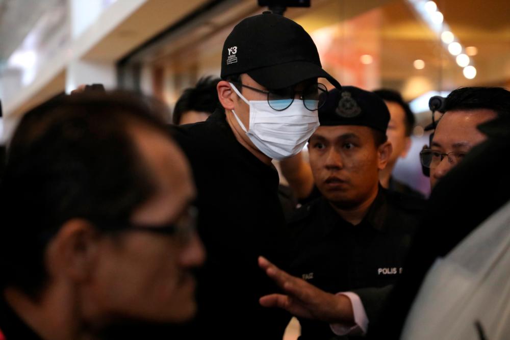 Japanese badminton player Kento Momota arrives at Kuala Lumpur International Airport, as he leaves for Tokyo, after he was released from hospital following an injury in a vehicle collision on Monday, in Sepang, Malaysia, Jan 15, 2020. — Reuters