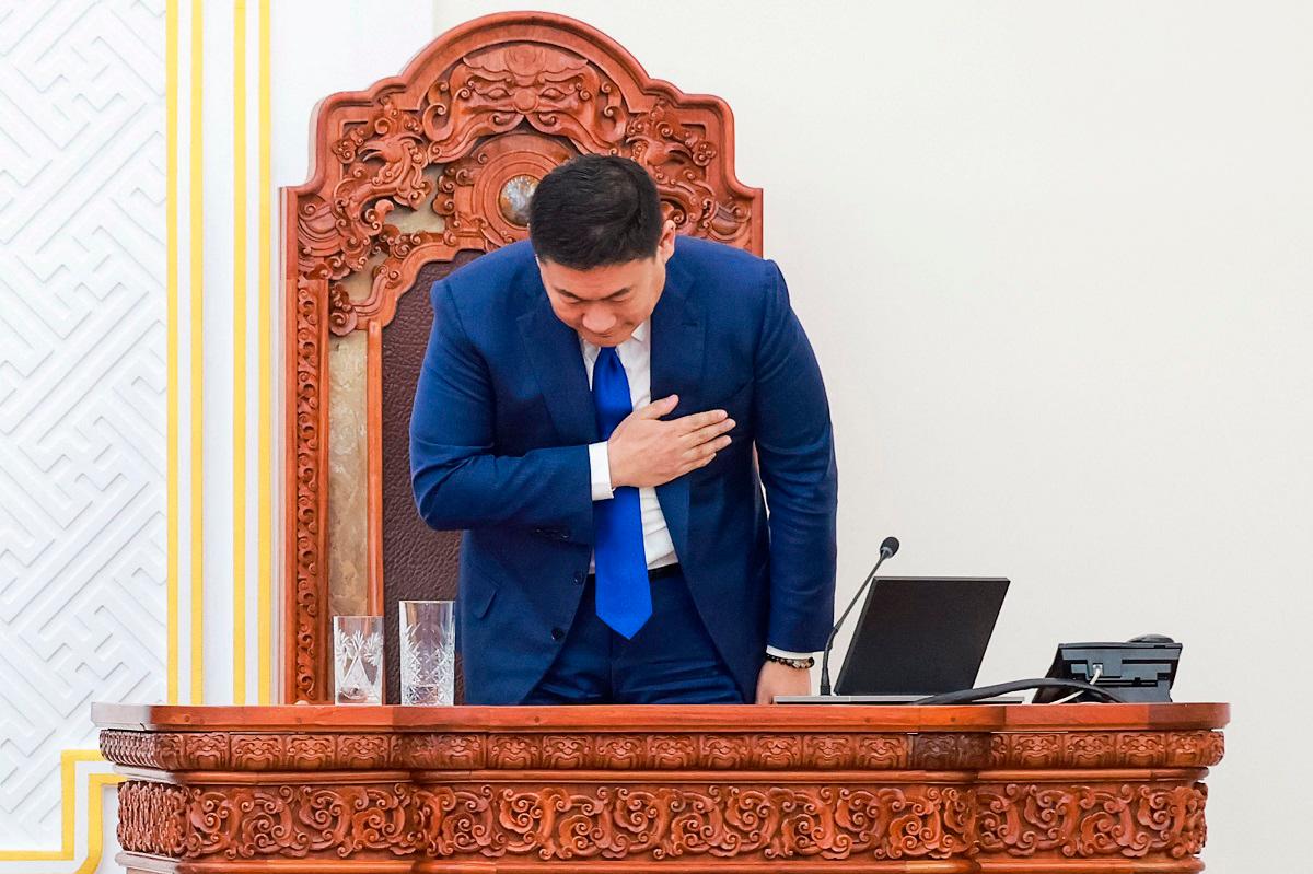 Mongolia's Prime Minister Luvsannamsrain Oyun-Erdene bows after losing his position in a vote in Ulaanbaatar, capital city of Mongolia on June 3, 2025. Mongolian Prime Minister Luvsannamsrain Oyun-Erdene resigned on June 3, a parliamentary statement said, after losing a confidence vote among lawmakers. The secret ballot followed days of protests in the capital Ulaanbaatar against alleged corruption. Oyun-Erdene will remain as caretaker prime minister until his successor is appointed within 30 days, the statement said. - Byambasuren BYAMBA-OCHIR / AFP