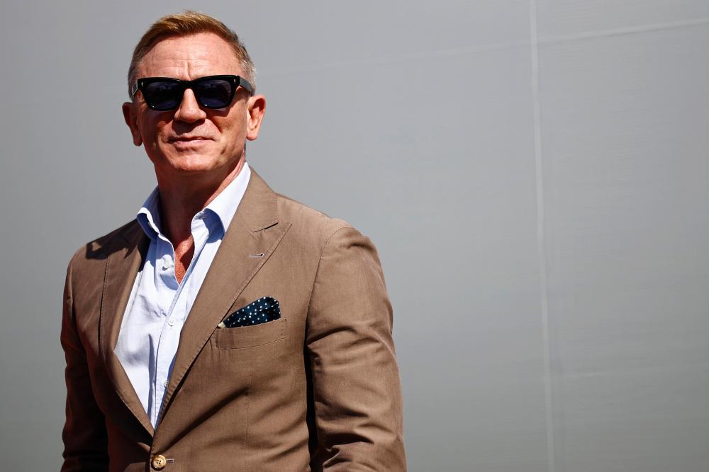 Actor Daniel Craig attends pre-race ceremonies prior to the NASCAR Cup Series Bank of America ROVAL 400 at Charlotte Motor Speedway on October 10, 2021 in Concord, North Carolina.AFPpix
