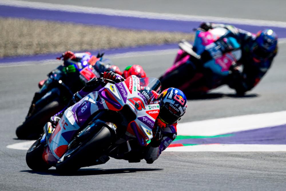 Prima Pramac Racing French rider Johann Zarco (C), Monster Energy Yamaha MotoGP French rider Fabio Quartararo (L) and CryptoDATA RNF Aprilia MotoGP Team Portuguese rider Miguel Oliveira compete during the MotoGP Austrian Grand Prix at the Red Bull Ring racetrack in Spielberg bei Knittelfeld, Austria, on August 20, 2023/AFPPix