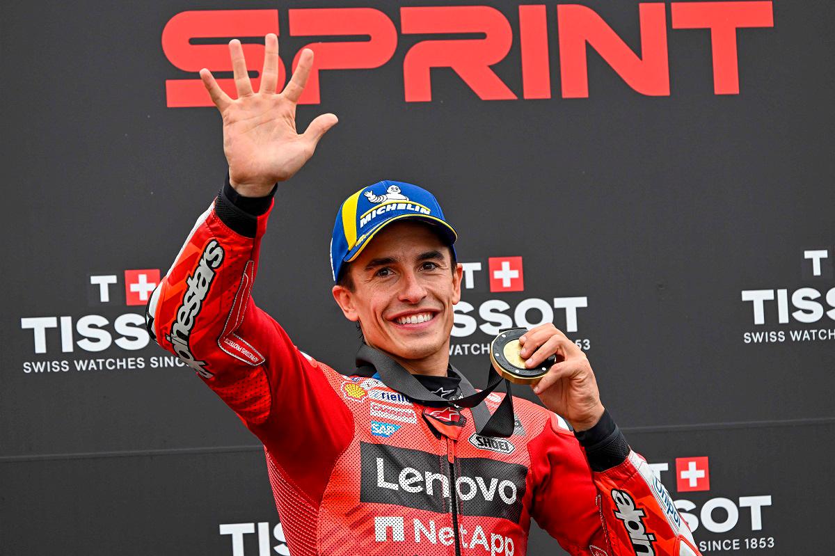 Ducati Lenovo Team’s Spanish rider Marc Marquez celebrates his victory with his gold medal after the sprint race ahead of the motorcycle Hungarian Moto GP Grand Prix at the Balaton Park circuit in Balatonfokajar, Hungary, on August 23, 2025. - ATTILA KISBENEDEK / AFP