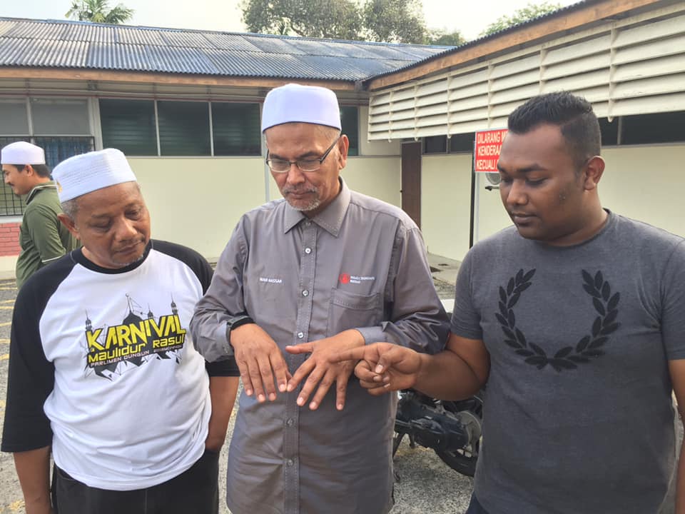 Dungun MP Wan Hassan Mohd Ramli (C), after he was robbed by snatch Wan Hassan Mohd Ramli (Official)thieves, in Jalan Pak Sabah, on July 25, 2019. — Facebook photo courtesy Wan Hassan Mohd Ramli (Official).