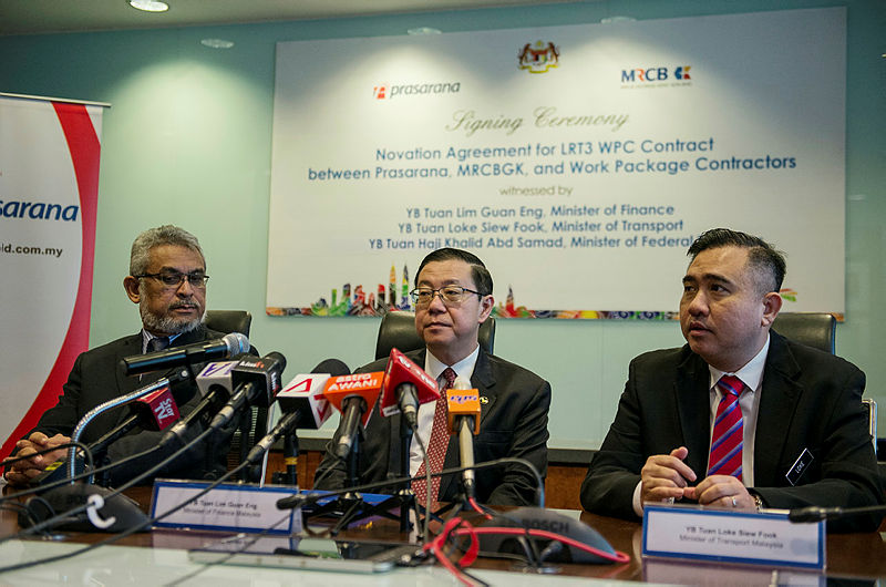 From left: Federal Territories Minister, Khalid Abdul Samad, Finance Minister Lim Guan Eng and Transport Minister Anthony Loke, following the signing of the novation agreement the Light Rail Transit 3 (LRT), at Menara UOA, in Bangsar, on Feb 22, 2019. — Bernama