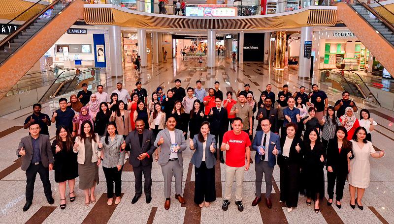 Sunway Velocity Mall senior general manager Phang Sau Lian (front row, 7th from left) and Sunway Malls &amp; Theme Parks CEO HC Chan (front row, red t-shirt).