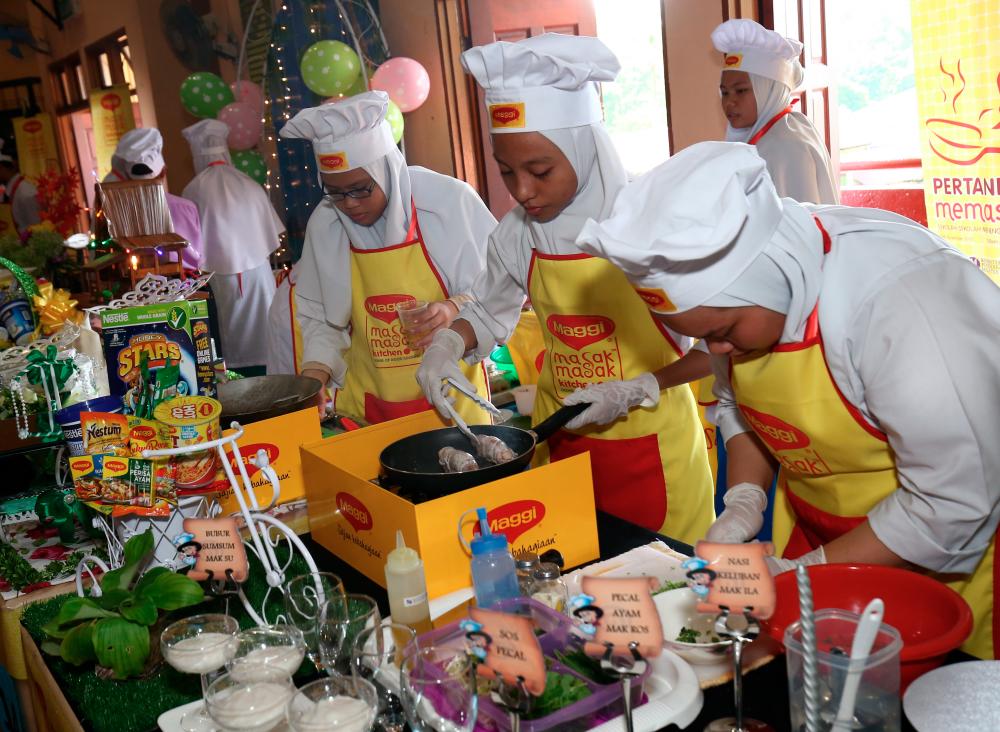 Students showcasing their culinary skills.