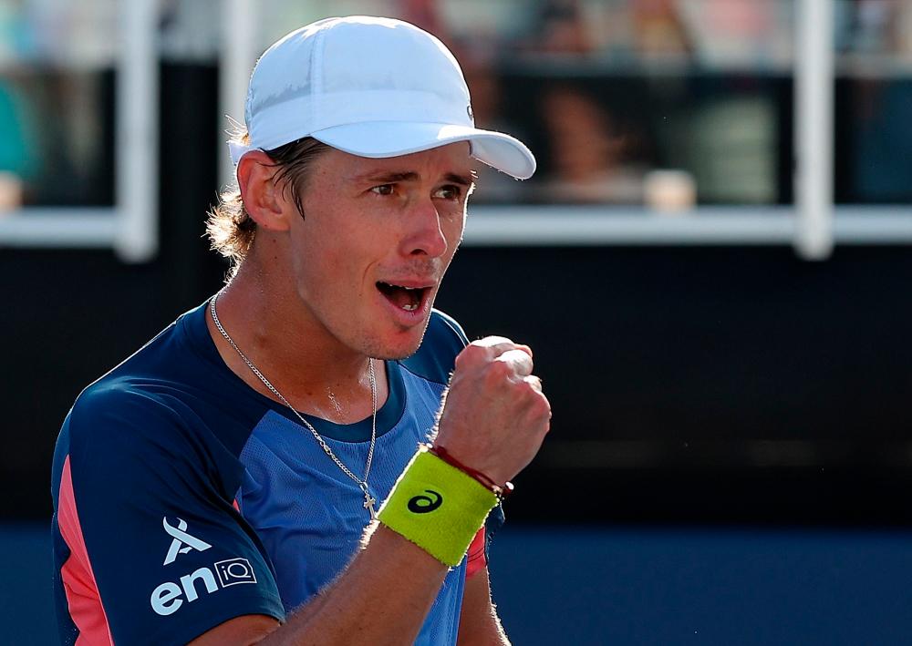 ATLANTA, GEORGIA - JULY 31: Alex de Minaur of Australia reacts after defeating Jenson Brooksby during the singles final of the Atlanta Open at Atlantic Station on July 31, 2022 in Atlanta, Georgia. AFPPIX