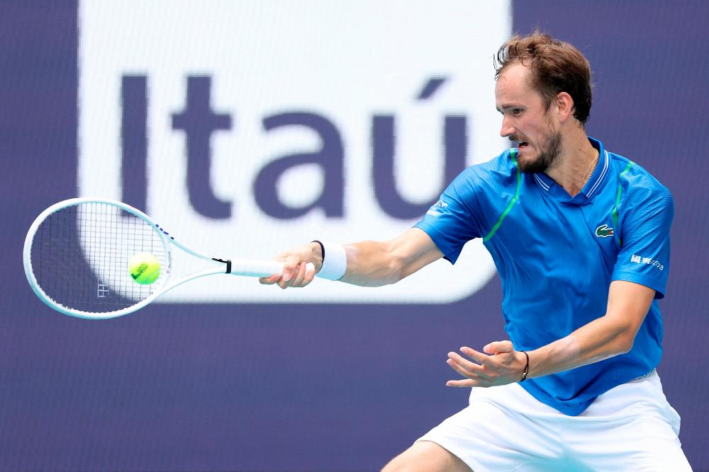 MIAMI GARDENS, FLORIDA - MARCH 30: Daniil Medvedev of Russia returns a shot to Christopher Eubanks of the United States during the quarterfinals of the Miami Open at Hard Rock Stadium on March 30, 2023 in Miami Gardens, Florida. AFPPIX