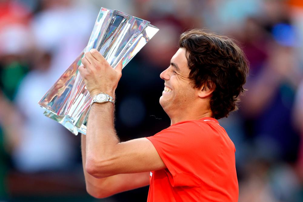 INDIAN WELLS, CALIFORNIA - MARCH 20: Taylor Fritz celebrates his win against Rafael Nadal of Spain during the men’s final of the BNP Paribas Open at the Indian Wells Tennis Garden on March 20, 2022 in Indian Wells, California. AFPPIX