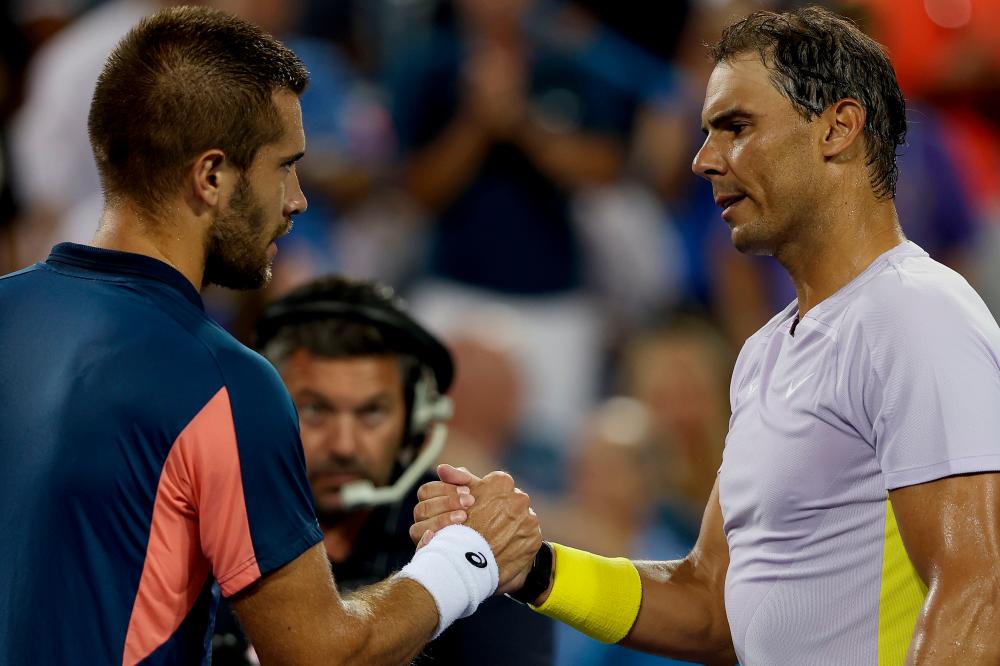 MASON, OHIO - AUGUST 17: Borna Coric of Croatia is congratulated by Rafael Nadal of Spain after their match during the Western &amp; Southern Open at Lindner Family Tennis Center on August 17, 2022 in Mason, Ohio. AFPPIX