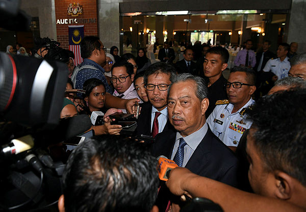 Home Minister Tan Sri Muhyiddin Yassin responds to reporters’ questions after the launch of the Home Ministry’s National Month celebration today. — Bernama