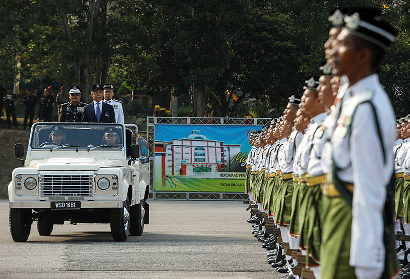 Home Minister Tan Sri Muhyiddin Yassin and Prisons director-general Datuk Seri Zulkifli Omar inspect a guard of honour during the 229th Prison Day celebration, on March 20, 2019. — Sunpix by Ashraf Shamsul