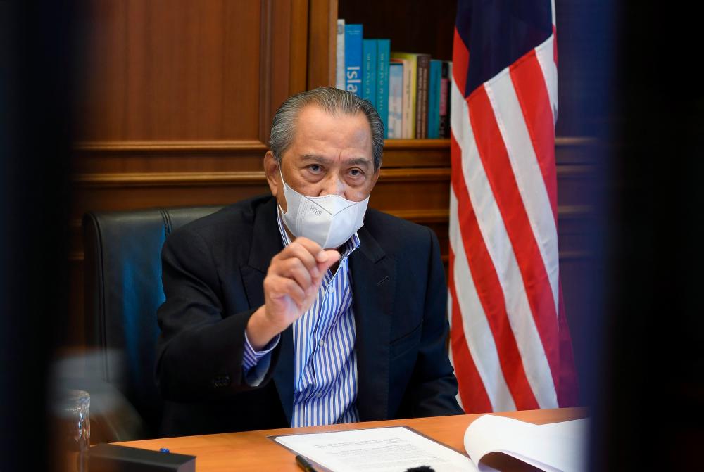 Prime Minister Tan Sri Muhyiddin Yassin speaking during a virtual press conference on developments during the government's fight against the Covid-19 pandemic at his office today. — Bernama