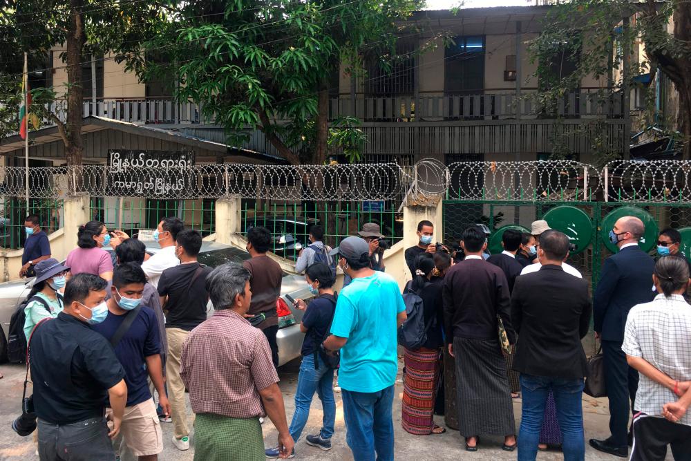 Members of the media gather outside Kamaryut Court in Yangon on March 12, 2021, as the court held a hearing in the case of Associated Press (AP) photographer Thein Zaw, who was arrested as he covered a demonstration against the military coup. — AFP