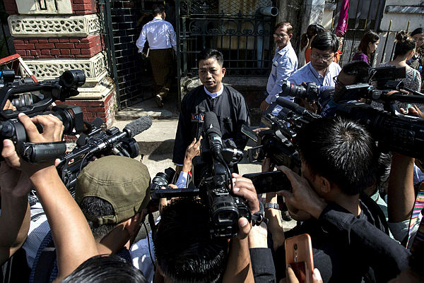 Than Zaw Aung (C), lawyer of jailed Myanmar journalists Wa Lone and Kyaw Soe Oo speaks to journalists after a hearing at the High Court in Yangon on Dec 24, 2018. — AFP