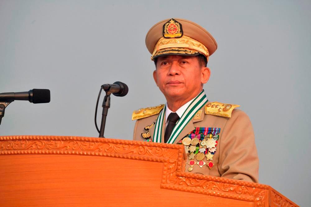 This handout photo taken and released on March 27, 2022 by the Myanmar Military Information Team shows Chief Senior General Min Aung Hlaing attending a ceremony to mark the country’s 77th Armed Forces Day in Naypyidaw. -AFPPIX