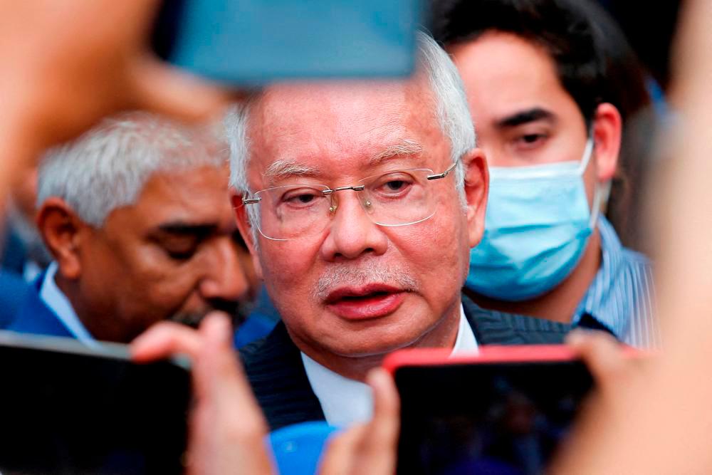 Former Malaysian Prime Minister Najib Razak speaks to journalists outside the Federal Court during a court break, in Putrajaya, Malaysia August 23, 2022. REUTERSpix