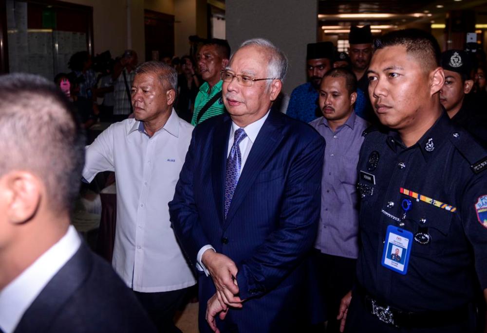 Najib, upon arrival at the Jalan Duta Court Complex, on April 3, 2019. — Sunpix by Amirul Syafiq Mohd Din