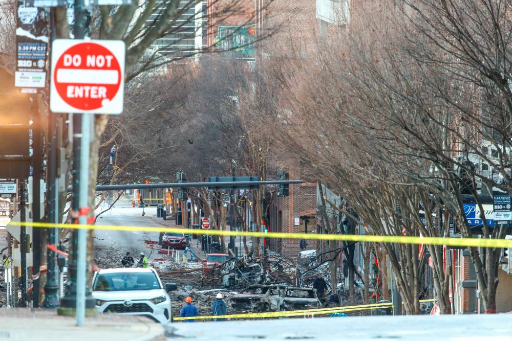 Police close off an area damaged by an explosion on Christmas morning on December 25, 2020 in Nashville, Tennessee. — AFP