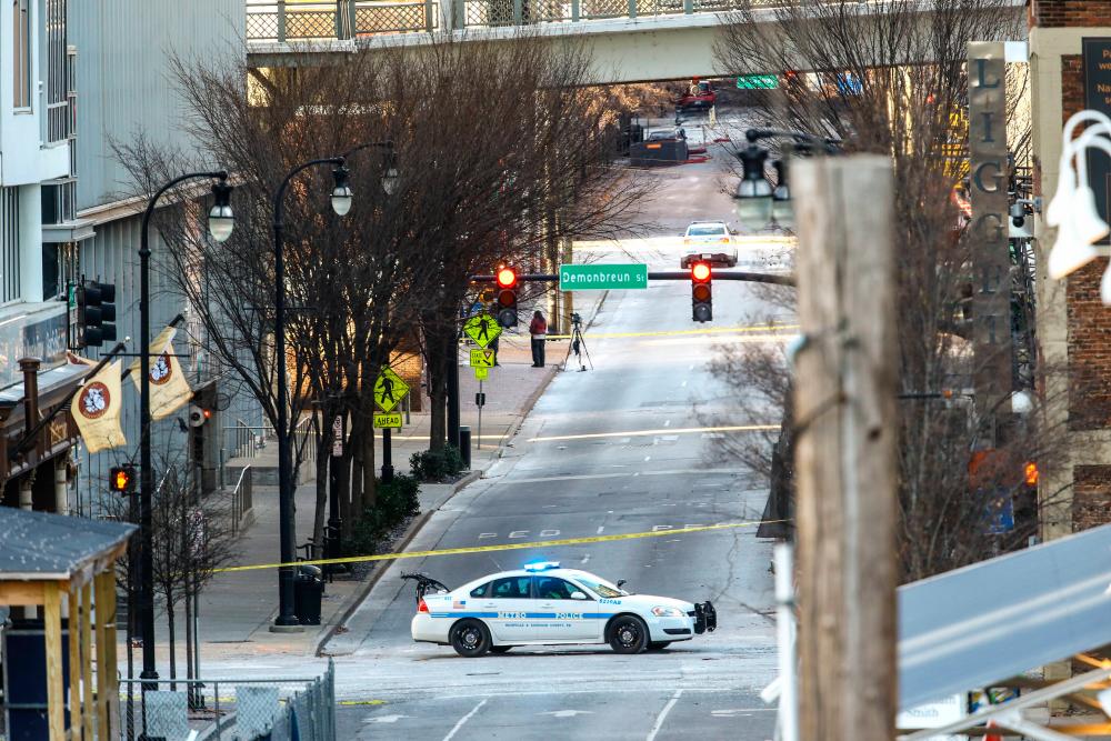 Police close off an area damaged by an explosion on Christmas morning on December 25, 2020 in Nashville, Tennessee. — AFP