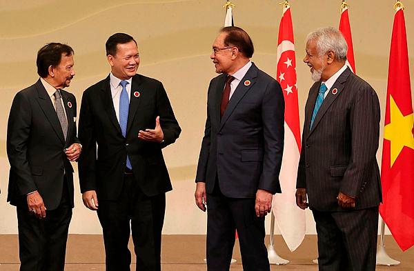 Malaysian Prime Minister Datuk Seri Anwar Ibrahim (third, left) having a light moment with (from left) Sultan Hassanal Bolkiah of Brunei Darussalam, Cambodia Prime Minister Hun Manet and Timor Leste Prime Minister Kay Rala Xanana Gusmao–Bernamapix