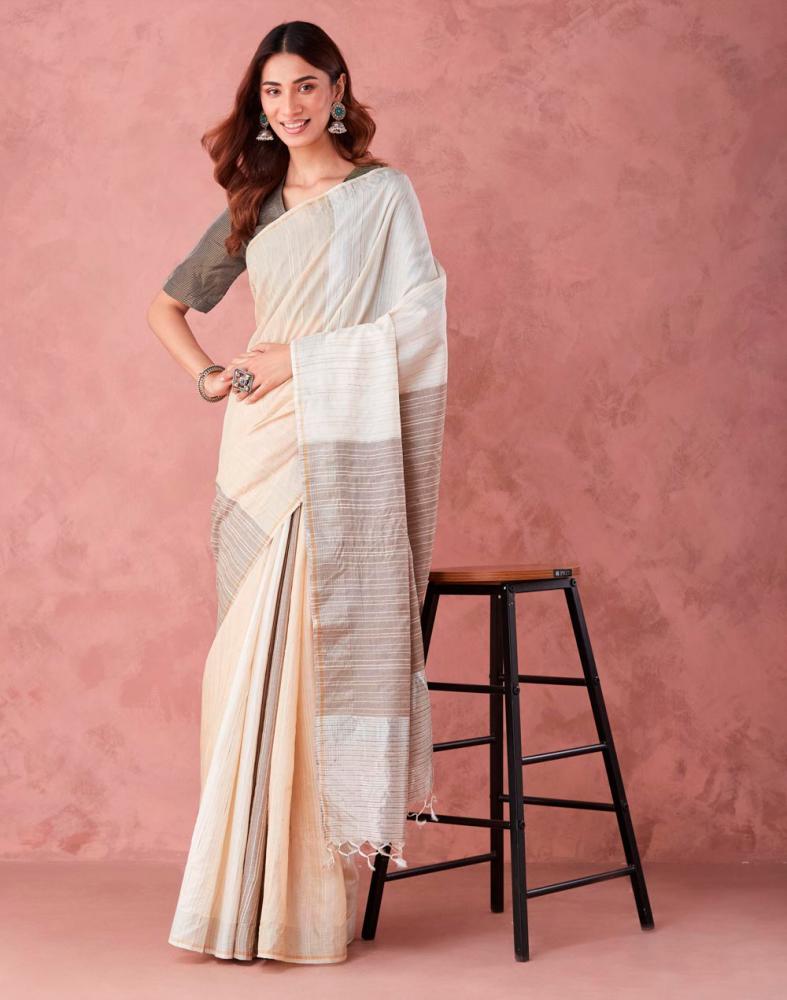 $!A minimalistic natural silk saree in ivory.