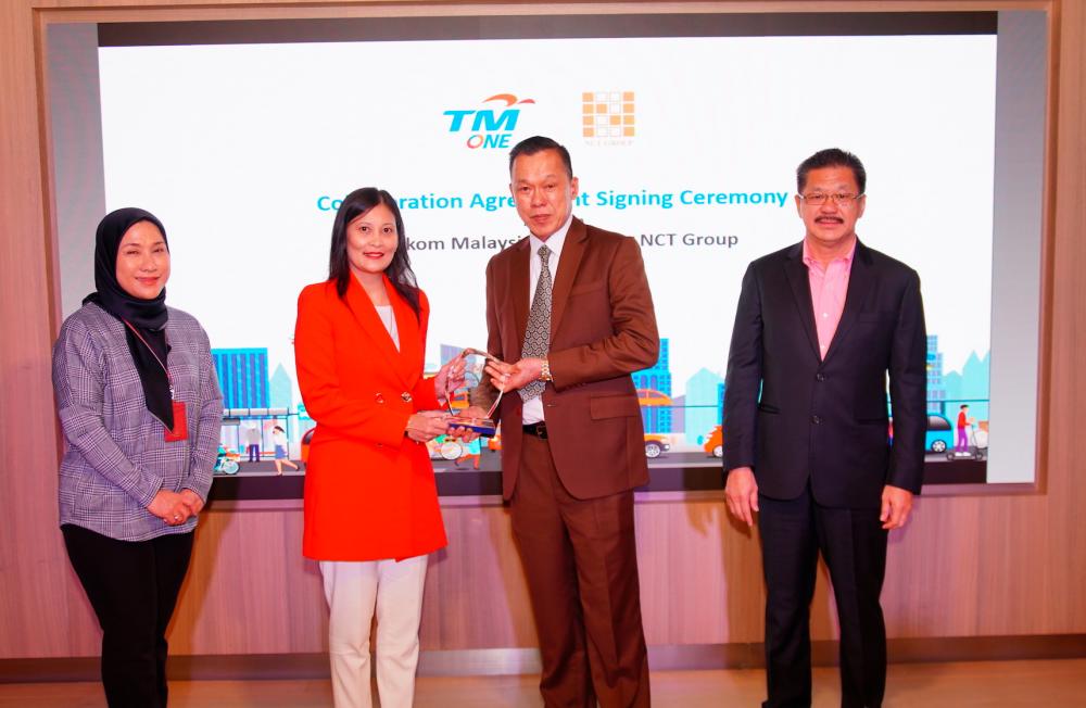 From right: NCT Group group executive director Datuk Yap Fook Choy, Yap Ngan Choy, Shazurawati and TM One head of enterprise sales Norazam Jaafar at the signing ceremony on Aug 9.
