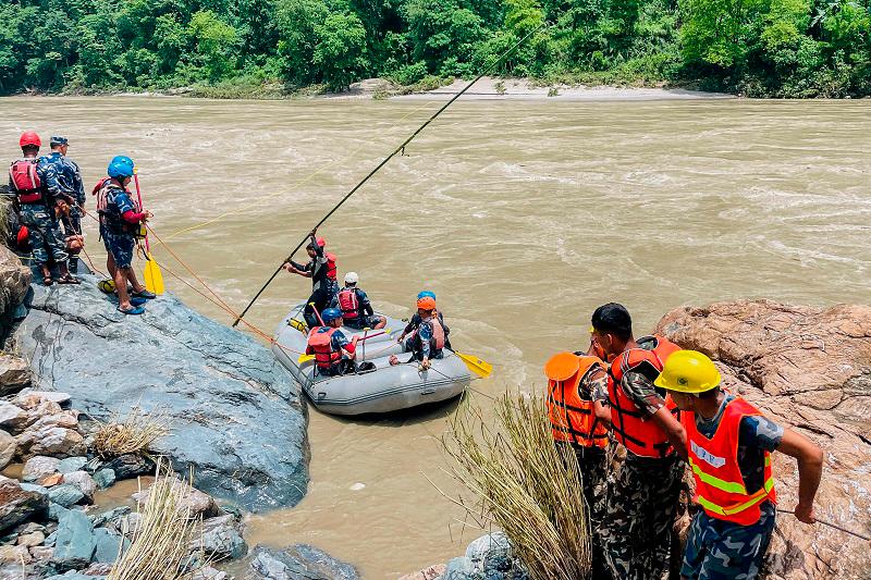 Members of Nepal’s Armed Police Force (APF) search for survivors in the Trishuli River at the site of a landslide following heavy rainfall in Simaltar on July 13, 2024. Nepali rescue teams resumed their search early on July 13 for at least 63 people missing after monsoon rains triggered a landslide that swept two buses off a highway and into a river. - AFPpix