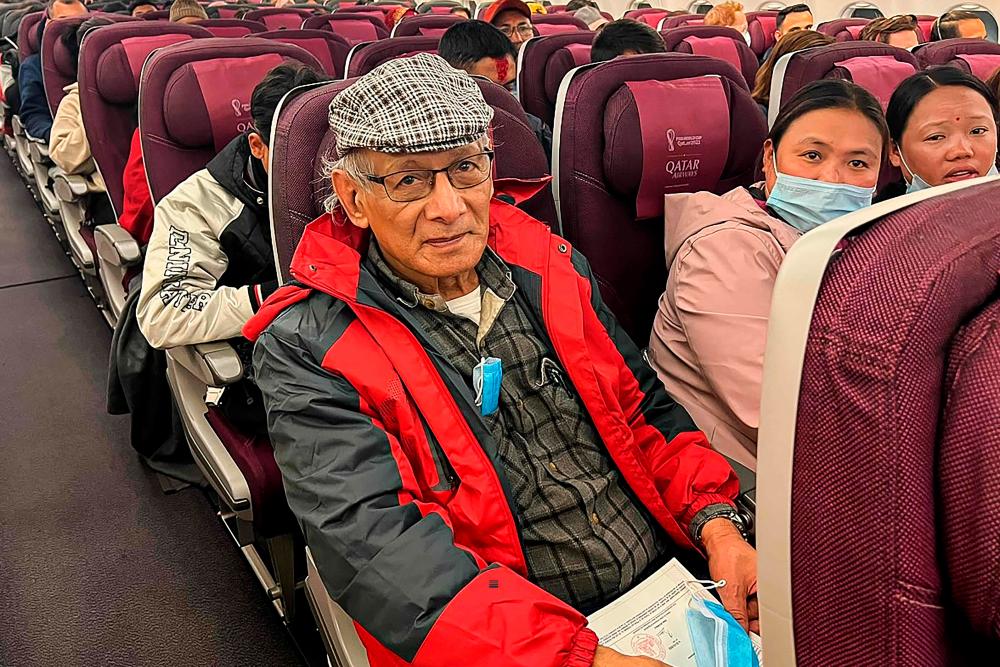 French serial killer Charles Sobhraj (C) sits in an aircraft departing from Kathmandu to France, on December 23, 2022. AFPPIX