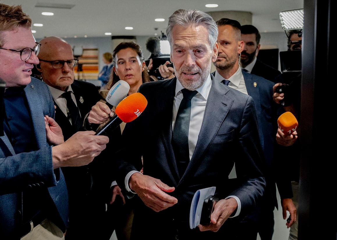Outgoing Dutch Prime Minister Dick Schoof (C) is surrounded by media as he arrives to take part in a debate in the Lower House focused on the fall of the cabinet in The Hague, The Netherlands on June 4 2025. (Photo by Remko de Waal / ANP / AFP)